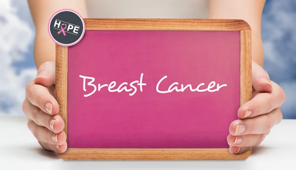 Composite image of females hands showing pink board — Stock Photo, Image