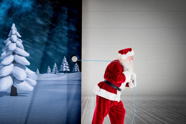 Immagine composita di Babbo Natale tirando corda — Foto Stock
