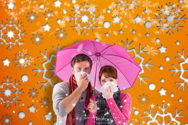 Imagem composta de casal em pé debaixo de um guarda-chuva — Fotografia de Stock