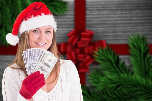 Festive blonde showing fan of dollars — Stock Photo, Image