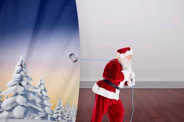 Composite image of santa claus pulling rope — Stock Photo, Image