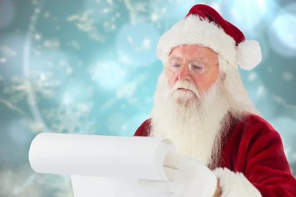 Samengestelde afbeelding van santa claus zijn lijst controleren — Stockfoto