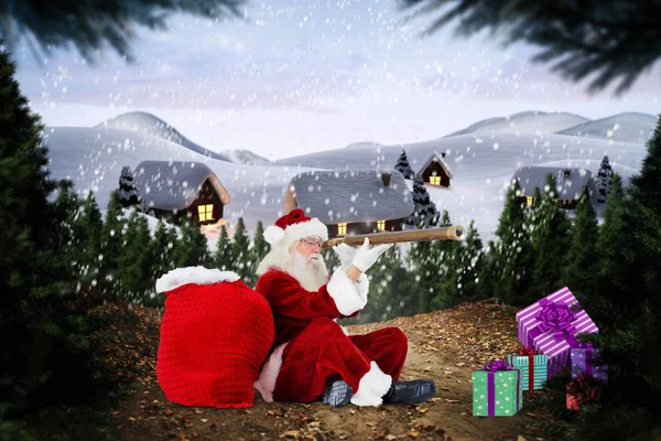 Samengestelde afbeelding van santa op zoek via telescoop — Stockfoto