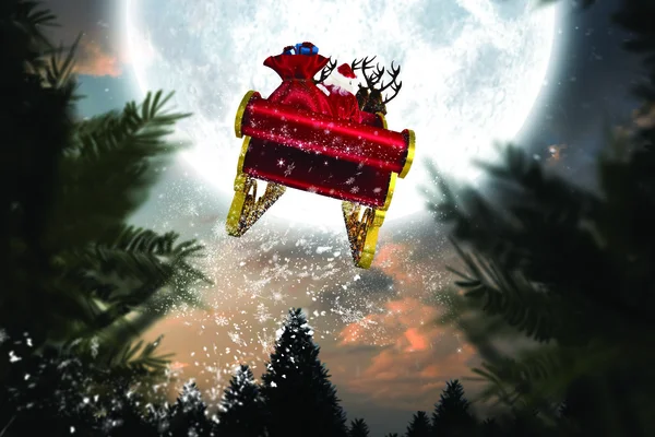 Image composite du Père Noël volant sur son traîneau — Photo