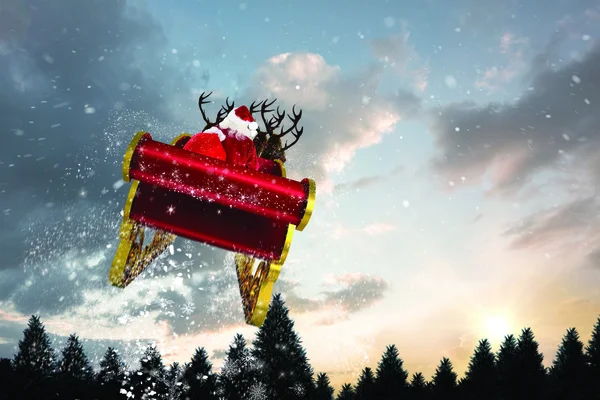 Composite image of santa flying his sleigh — Stock Photo, Image