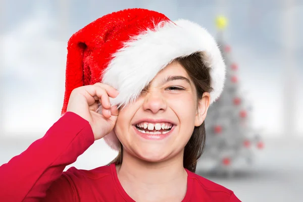 Imagem composta de menina festiva sorrindo para a câmera — Fotografia de Stock