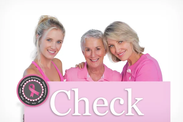 Mulheres felizes vestindo tops e fitas rosa — Fotografia de Stock