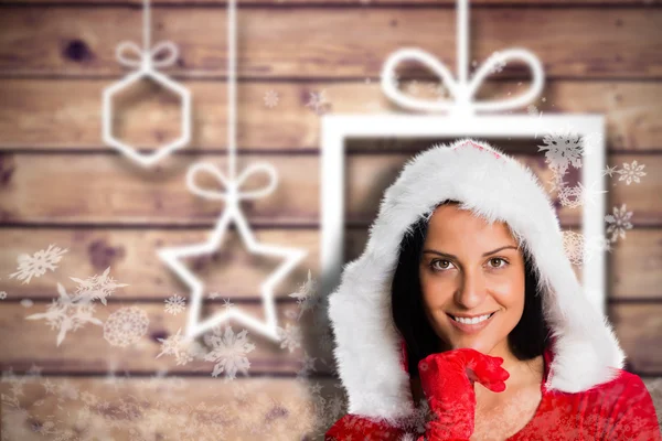 Imagen compuesta de una mujer sonriendo a la cámara — Foto de Stock