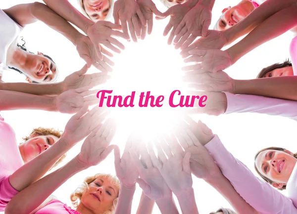 Happy women in circle wearing pink for breast cancer — Stock Photo, Image