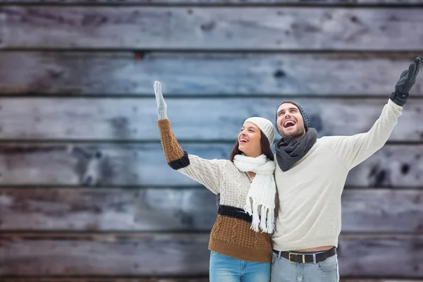 Composite image of young winter couple — Stock Photo, Image