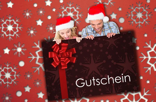 Composite image of young festive couple — Stock Photo, Image