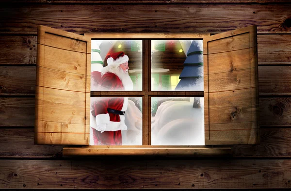 Noel Baba hediyeleri pencere karşı sunar. — Stok fotoğraf