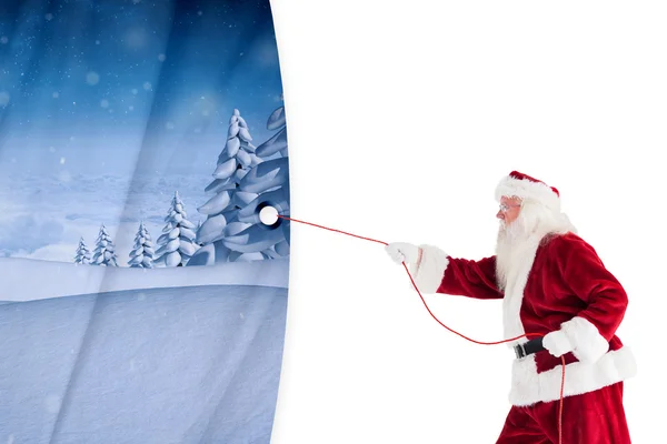 Santa claus pulling a rope — Stock Photo, Image