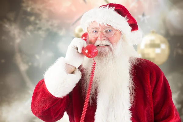 Composite image of santa claus on the phone — Stock Photo, Image