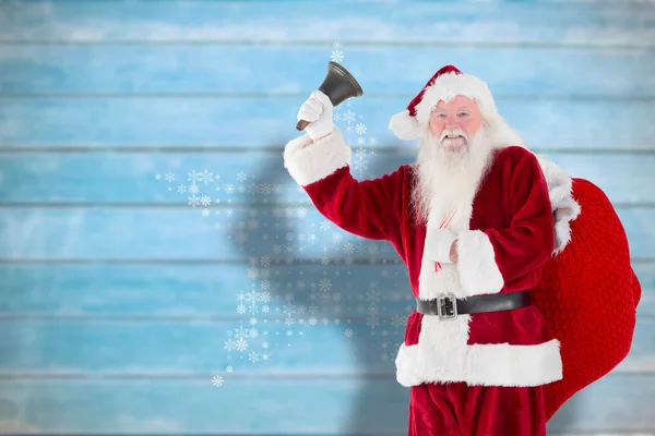 Composite image of santa claus ringing bell — Stock Photo, Image