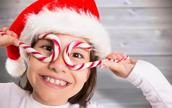 Imagen compuesta de la niñita festiva sonriendo a la cámara —  Fotos de Stock