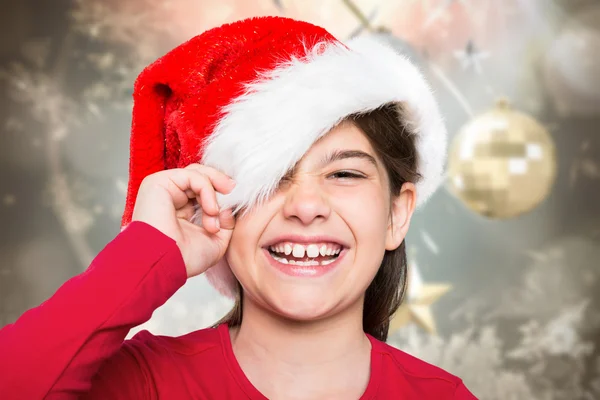 Imagem composta de menina festiva sorrindo para a câmera — Fotografia de Stock