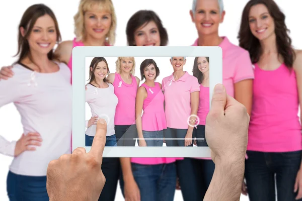 Composite image of hand holding tablet pc — Stock Photo, Image