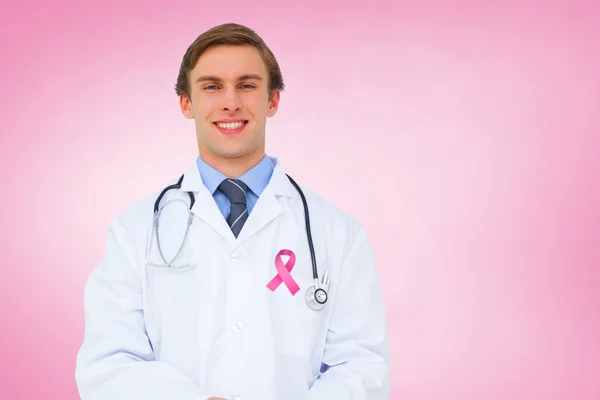 Composite image of young doctor using tablet pc — Stock Photo, Image