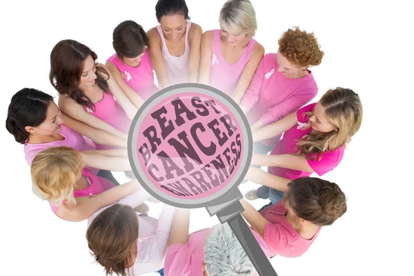 Cheerful women joined in a circle wearing pink — Stock Photo, Image