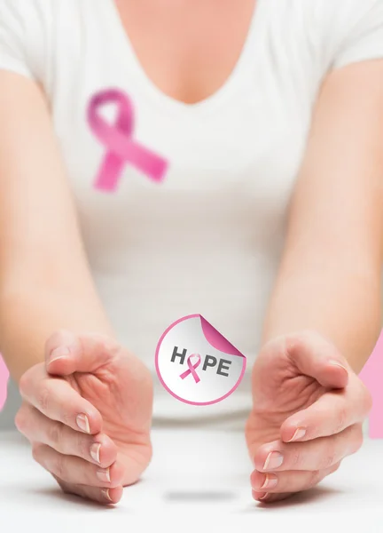 Woman presenting breast cancer awareness message — Stock Photo, Image