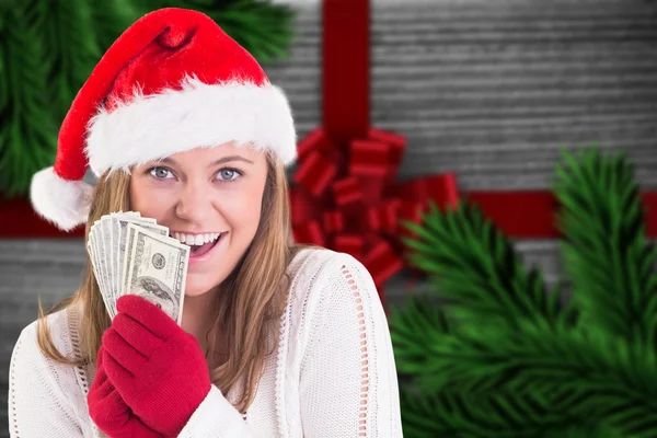 Festive blonde showing fan of dollars — Stock Photo, Image