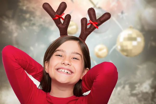 Immagine composita di bambina festosa che indossa corna — Foto Stock
