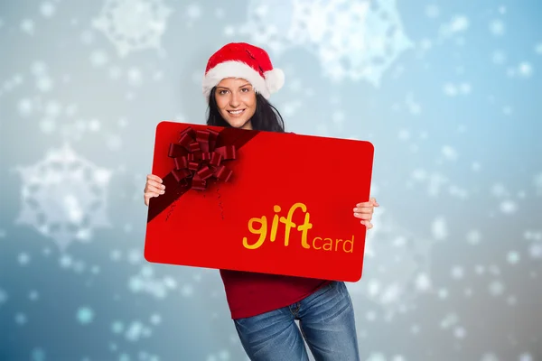 Composite image of woman holding a white sign — Stock Photo, Image