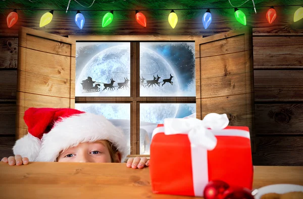 Immagine composita del ragazzo festivo che sbircia sul tavolo — Foto Stock
