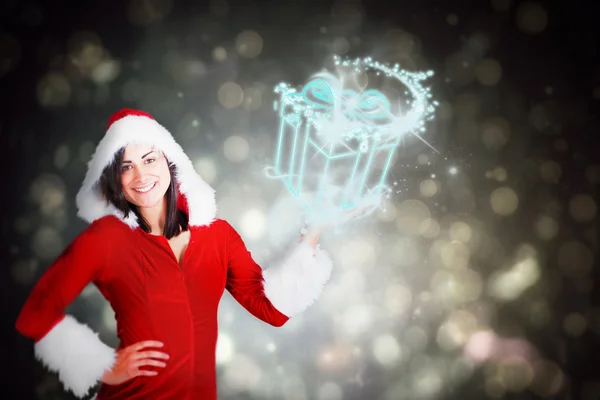 Pretty girl presenting in santa outfit — Stock Photo, Image