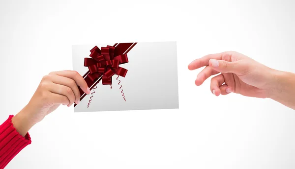 Composite image of hands holding card — Stock Photo, Image