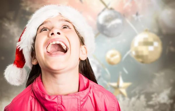 Imagen compuesta de niña festiva que parece sorprendida — Foto de Stock