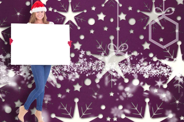 Festive blonde holding a poster — Stock Photo, Image