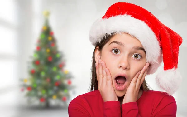 Imagen compuesta de niña festiva que parece sorprendida —  Fotos de Stock