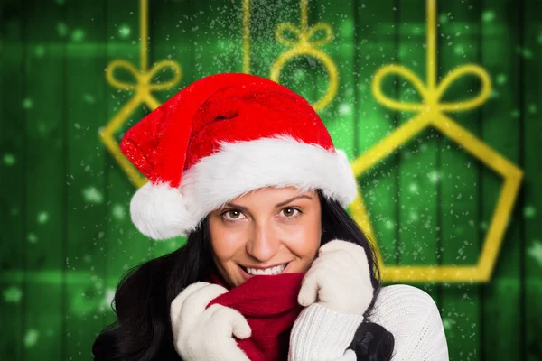 Imagen compuesta de una mujer sonriendo a la cámara — Foto de Stock