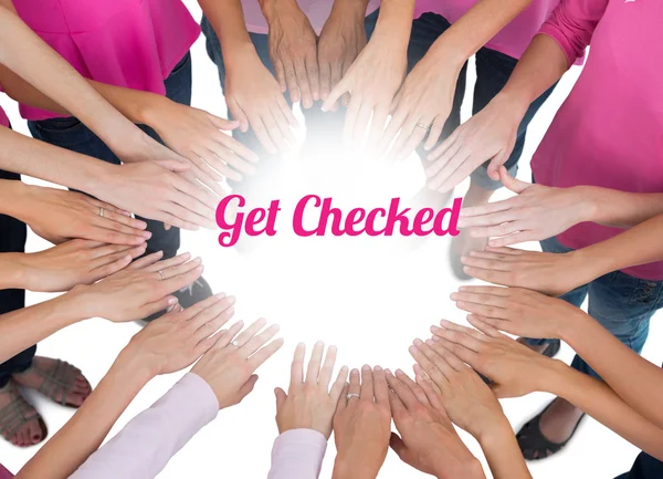 Hands joined in circle wearing pink for breast cancer — Stock Photo, Image