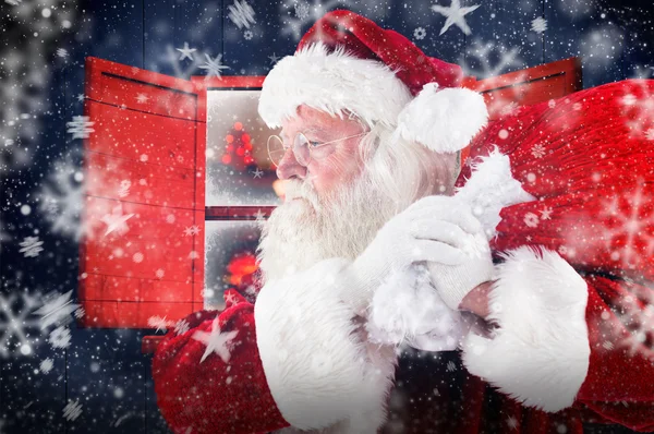 复合图像的圣诞老人背着麻袋 — 图库照片