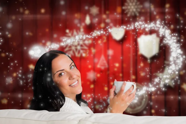 Composite image of woman enjoying a lovely drink — Stock Photo, Image