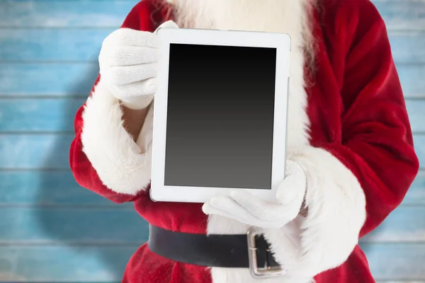 Sammansatta bilden av santa claus visar TabletPC — Stockfoto