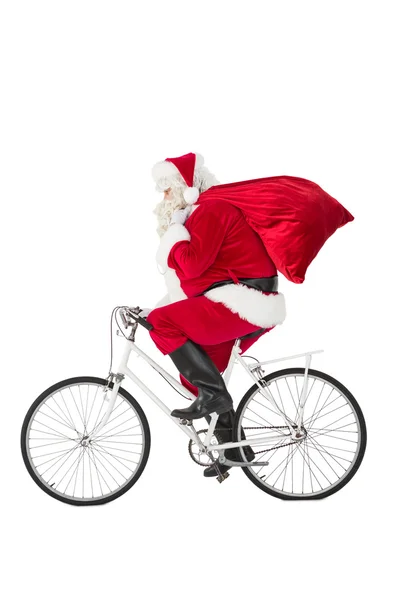 Weihnachtsmann überbringt Geschenke mit Fahrrad — Stockfoto