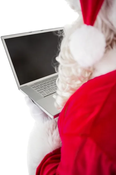 Weihnachtsmann mit seinem Laptop — Stockfoto