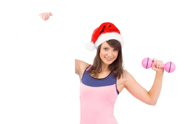 Morena en forma festiva sonriendo a la cámara sosteniendo cartel —  Fotos de Stock