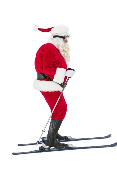 Festive father christmas skiing — Stock Photo, Image