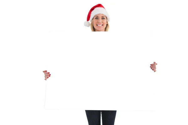 Festive blonde showing white poster — Stock Photo, Image