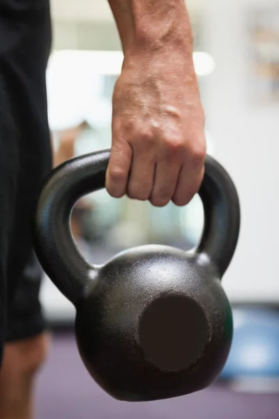 Cropped man holding kettle bell — Stock Photo, Image