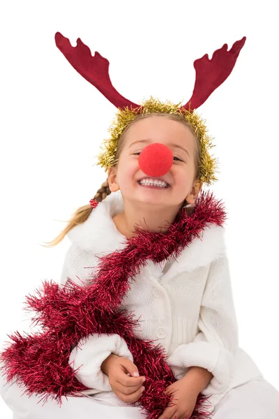 Cute little girl wearing red nose and tinsel — Stock Photo, Image
