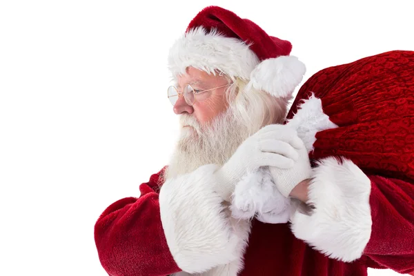 Santa draagt zijn rode zak — Stockfoto