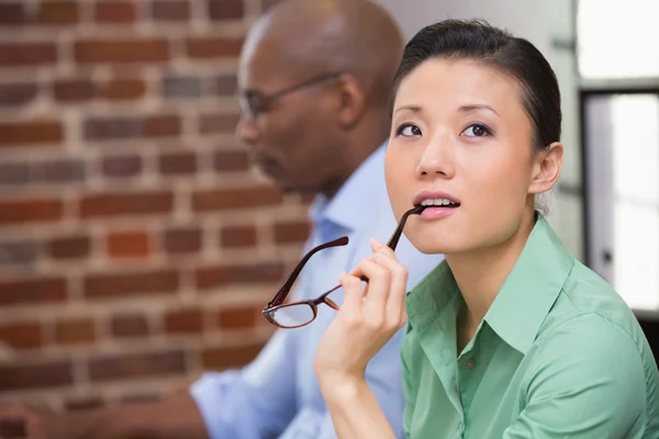 Thoughtful young businesswoman in office — Stock Photo, Image