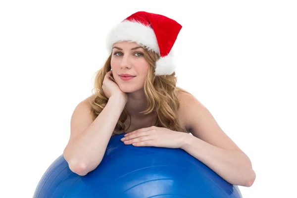 Festive fit blonde leaning on exercise ball — Stock Photo, Image