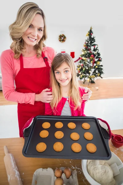 Festive mother and daughter making christmas cookies — Stock Photo, Image